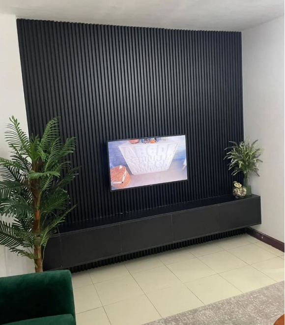 wall panels Kenya, decorative wall panels Nairobi, interior wall cladding, fluted panels (1) Matte Black Fluted TV Wall Panel - Image 1